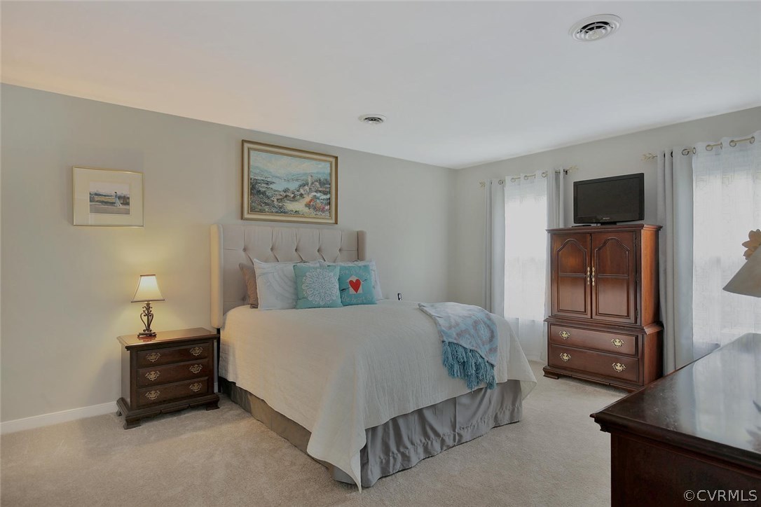 5717 Laurel Trail Road Midlothian, VA 23112 - Photo 18 of 28 a bedroom with a bed and a television