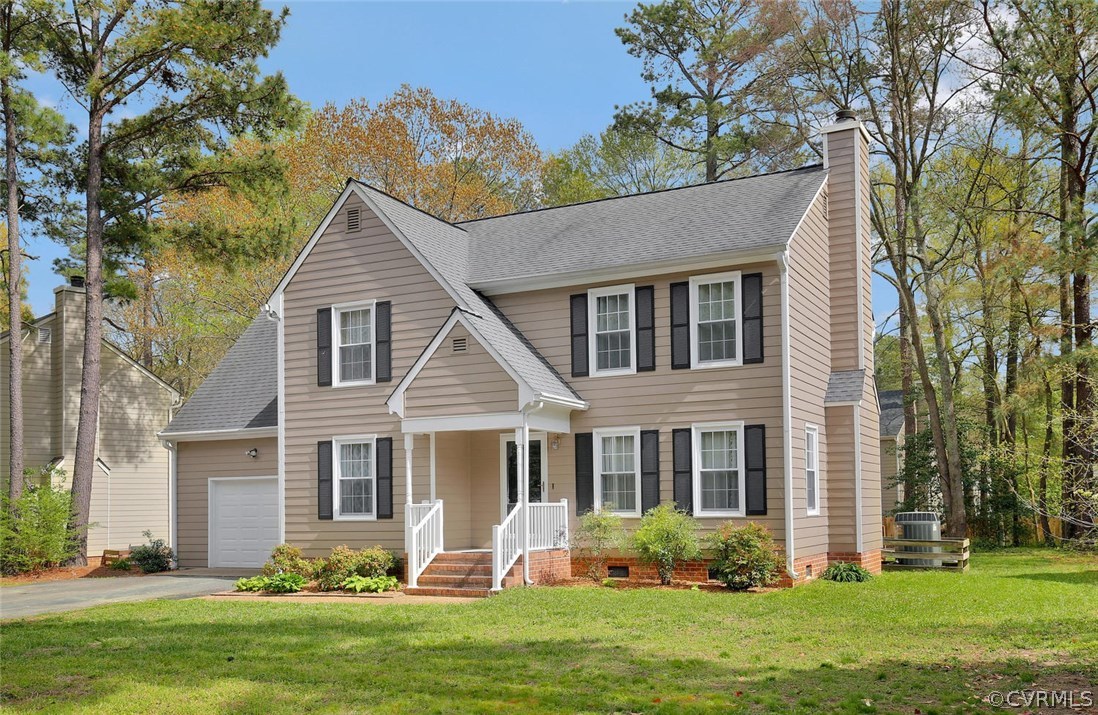 5717 Laurel Trail Road Midlothian, VA 23112 - Photo 2 of 28 a front view of a house with a yard