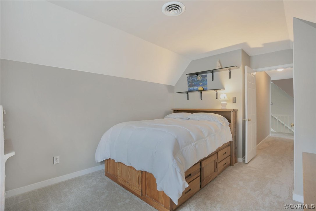 5717 Laurel Trail Road Midlothian, VA 23112 - Photo 23 of 28 a bedroom with a bed and a lamp