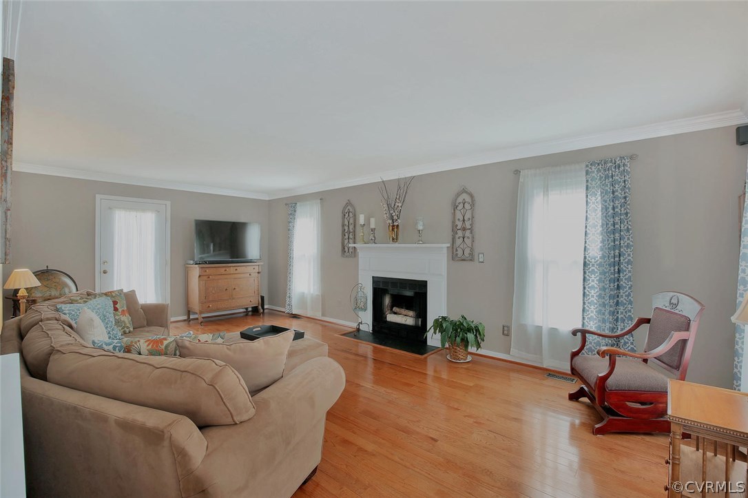 5717 Laurel Trail Road Midlothian, VA 23112 - Photo 4 of 28 a living room with furniture and a fireplace