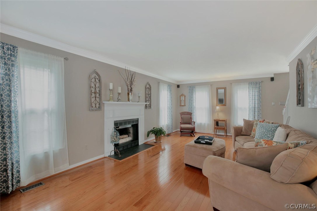 5717 Laurel Trail Road Midlothian, VA 23112 - Photo 5 of 28 a living room with furniture and a fireplace