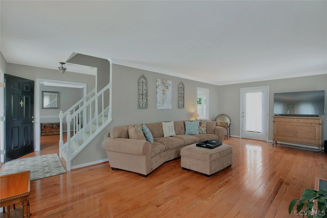 5717 Laurel Trail Road Midlothian, VA 23112 - Photo 6 of 28 a living room with furniture and a wooden floor