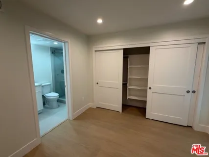 a bathroom with a toilet sink and shower
