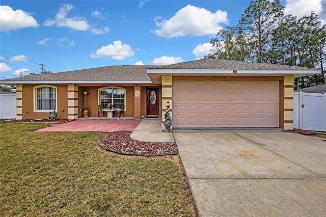 front view of a house with a yard