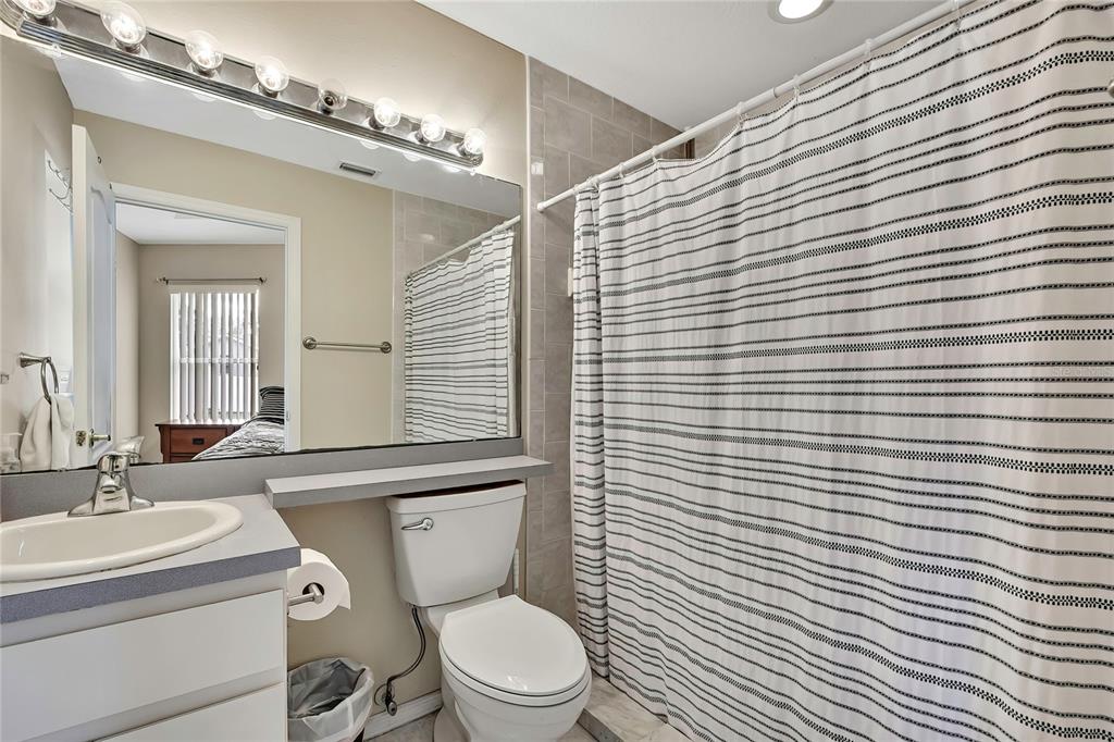 103 Daisy Lane Inverness, FL 34452 - Photo 17 of 40 a bathroom with a toilet a sink and mirror