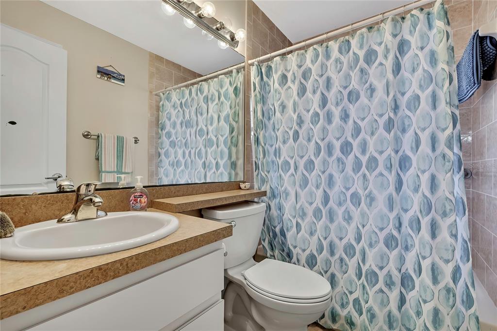 103 Daisy Lane Inverness, FL 34452 - Photo 20 of 40 a bathroom with a granite countertop sink and a mirror