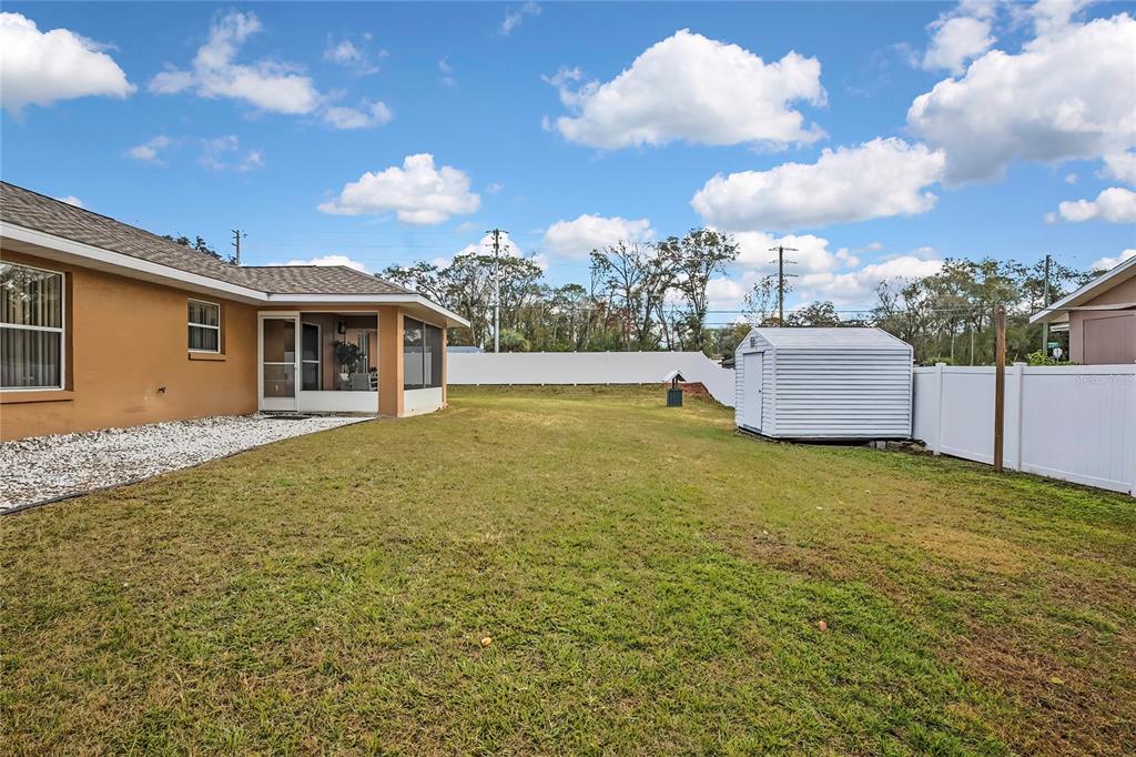 103 Daisy Lane Inverness, FL 34452 - Photo 28 of 40 a view of a house with a backyard