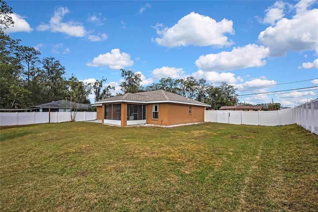 103 Daisy Lane Inverness, FL 34452 - Photo 32 of 40 a view of a house with a yard
