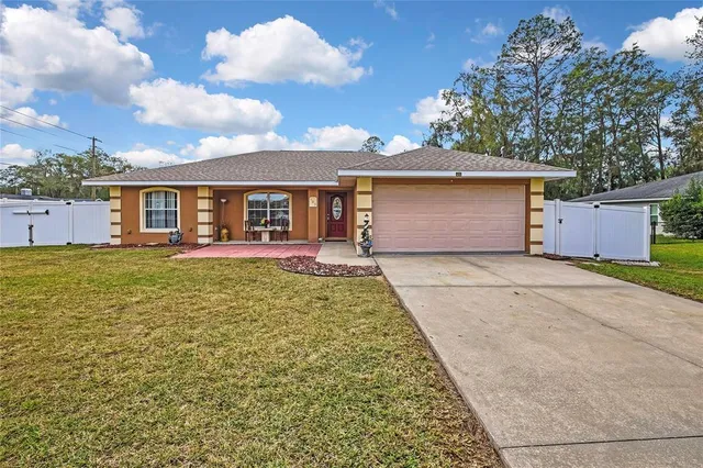 a view of a house with a yard