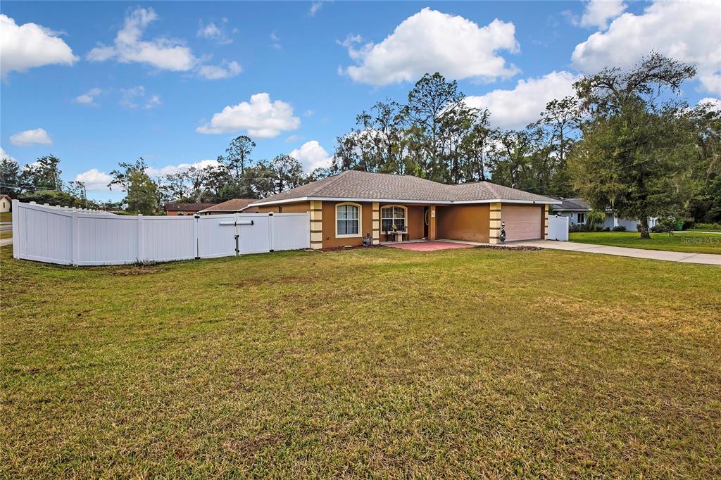 103 Daisy Lane Inverness, FL 34452 - Photo 37 of 40 a view of a house with a yard