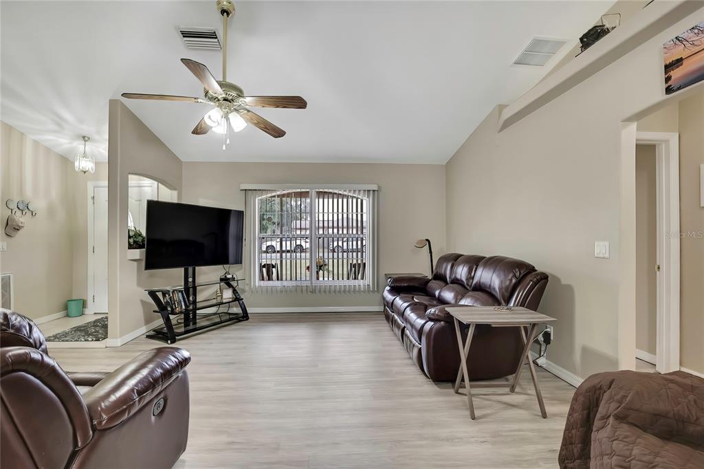 103 Daisy Lane Inverness, FL 34452 - Photo 7 of 40 a living room with furniture window and a flat screen tv