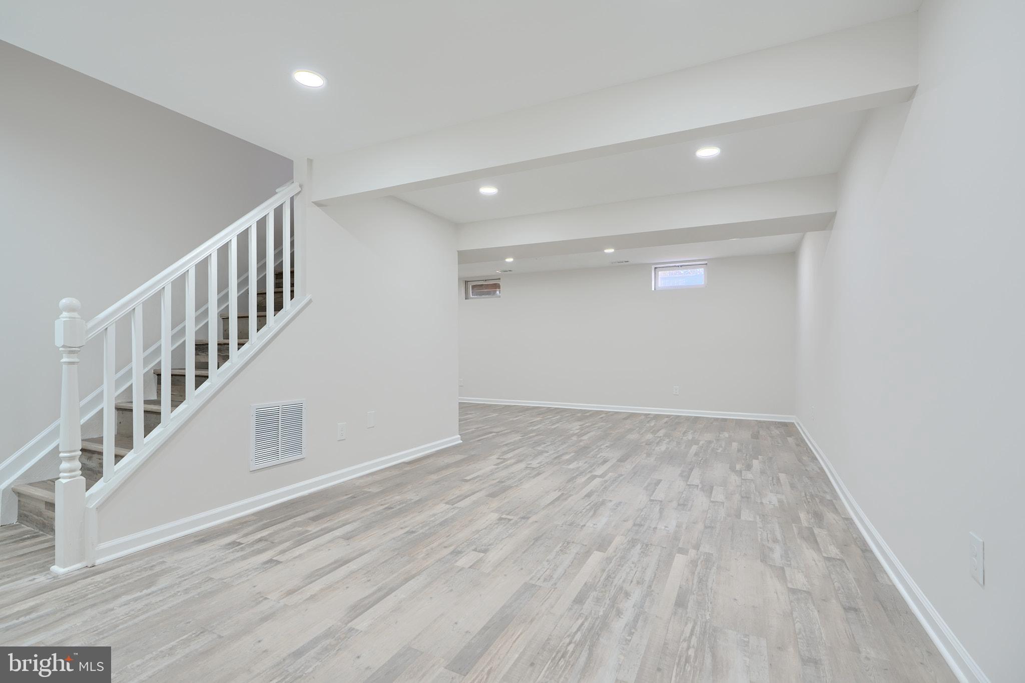 2801 Claybrooke Drive Windsor Mill, MD 21244 - Photo 33 of 63 Huge basement area with luxury vinyl