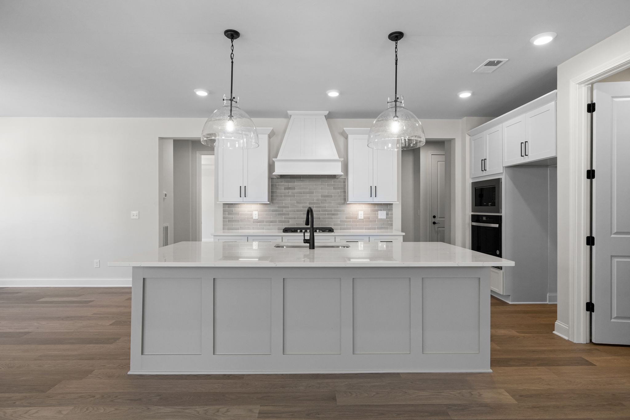 7318 Winners Road Murfreesboro, TN 37129 - Photo 16 of 44 a large kitchen with granite countertop a sink stainless steel appliances and cabinets