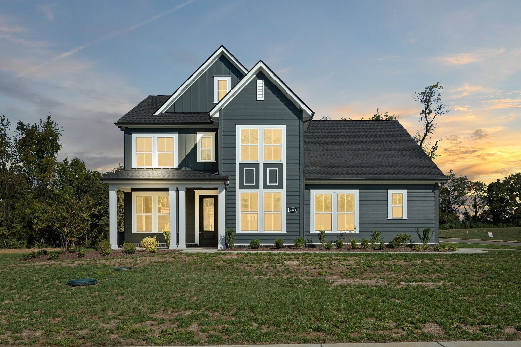 7318 Winners Road Murfreesboro, TN 37129 - Photo 2 of 44 a front view of a house with a garden