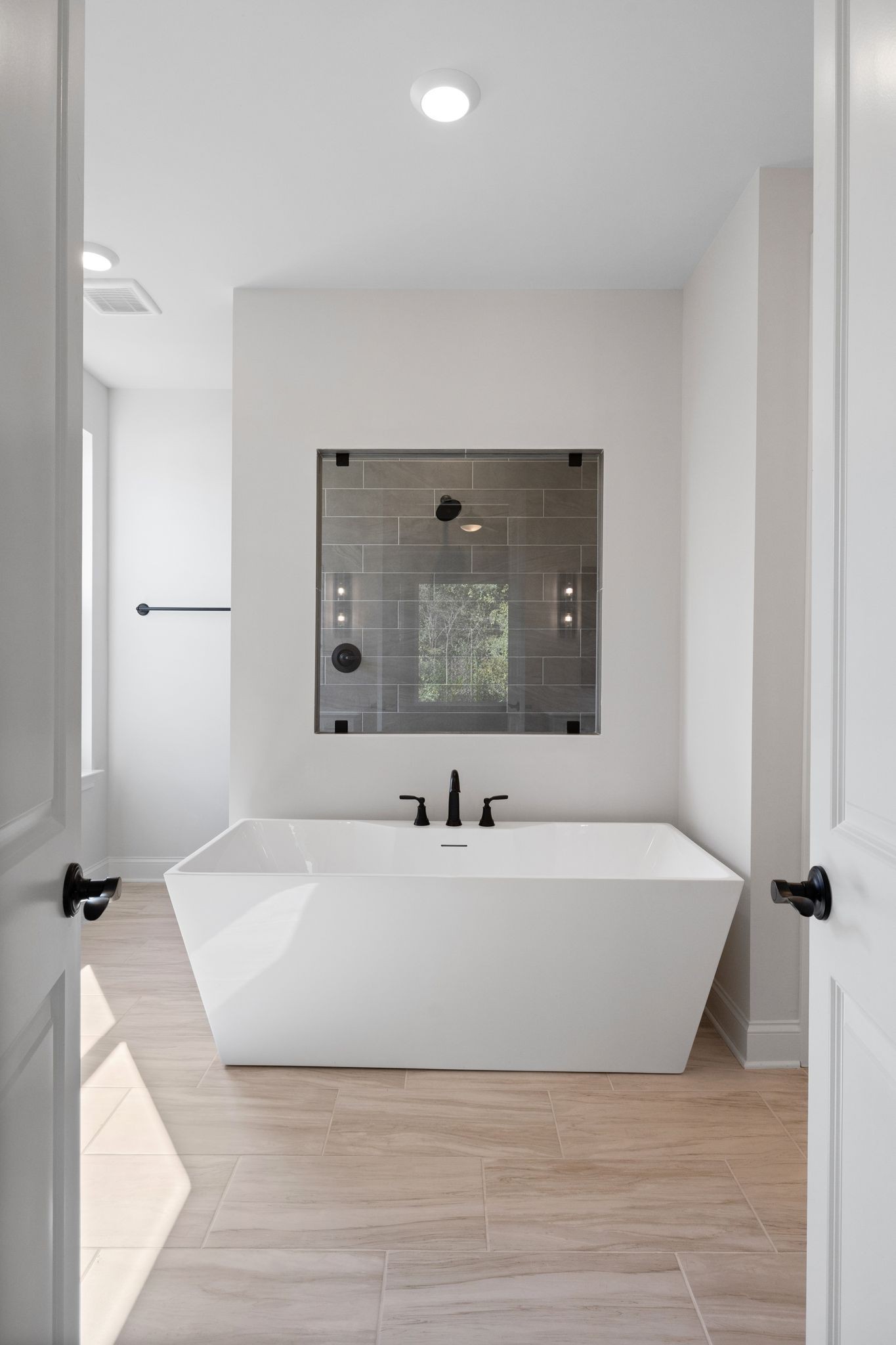 7318 Winners Road Murfreesboro, TN 37129 - Photo 25 of 44 a spacious bathroom with a bathtub and mirror
