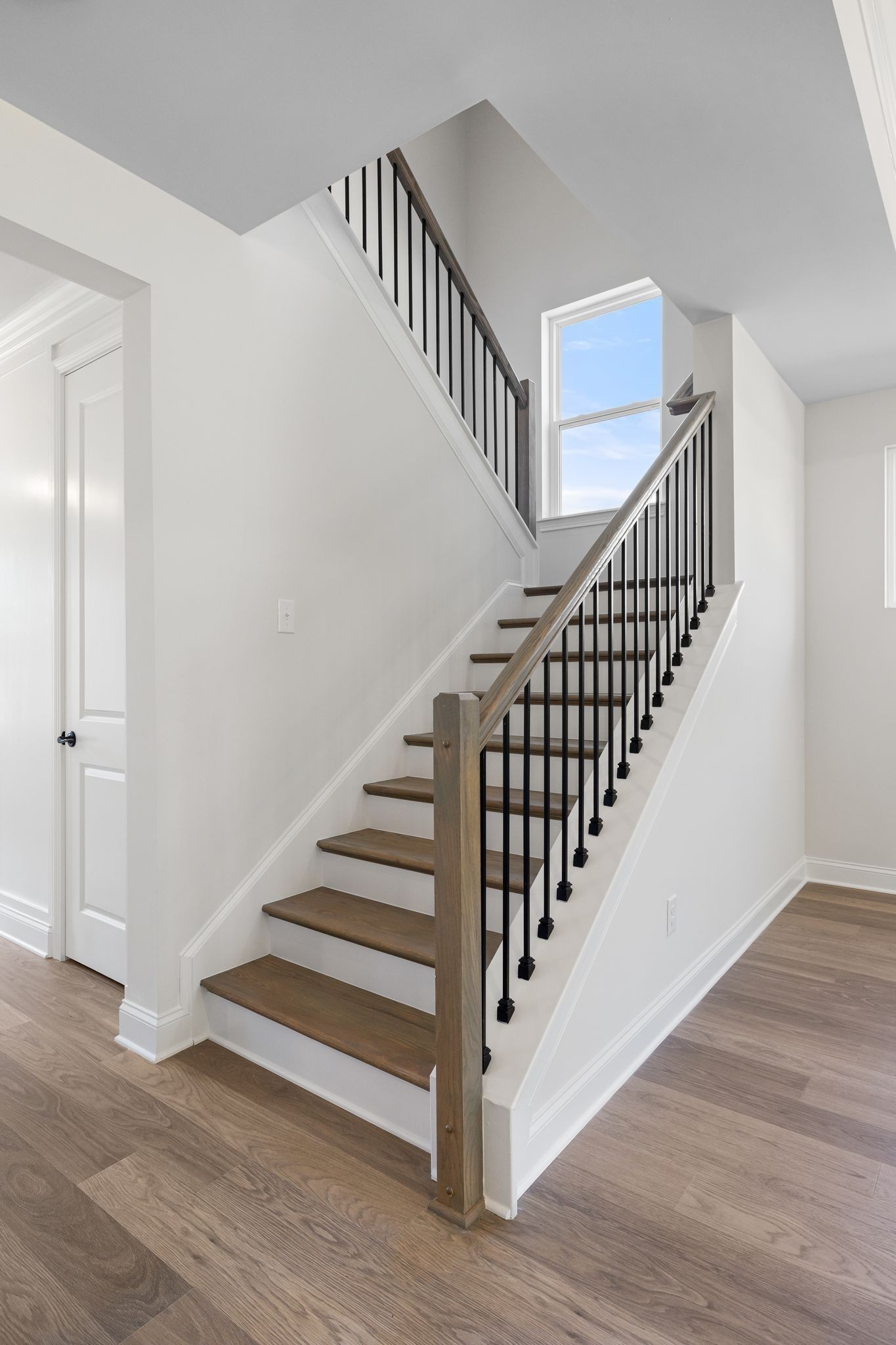 7318 Winners Road Murfreesboro, TN 37129 - Photo 28 of 44 a view of staircase with wooden floor and white walls
