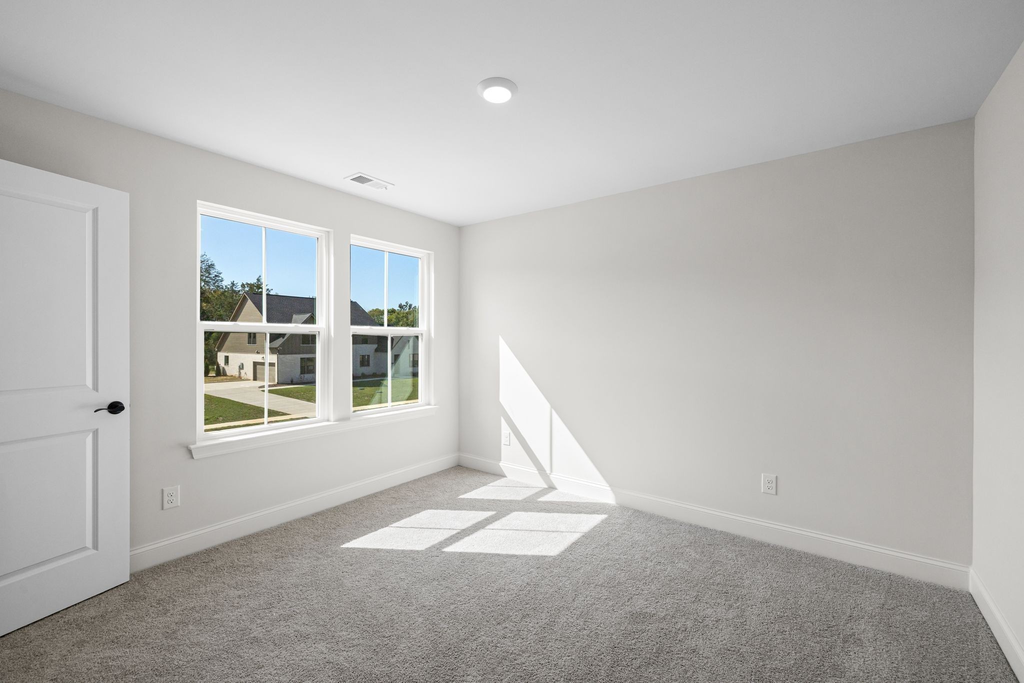 7318 Winners Road Murfreesboro, TN 37129 - Photo 29 of 44 an empty room with a fireplace and windows