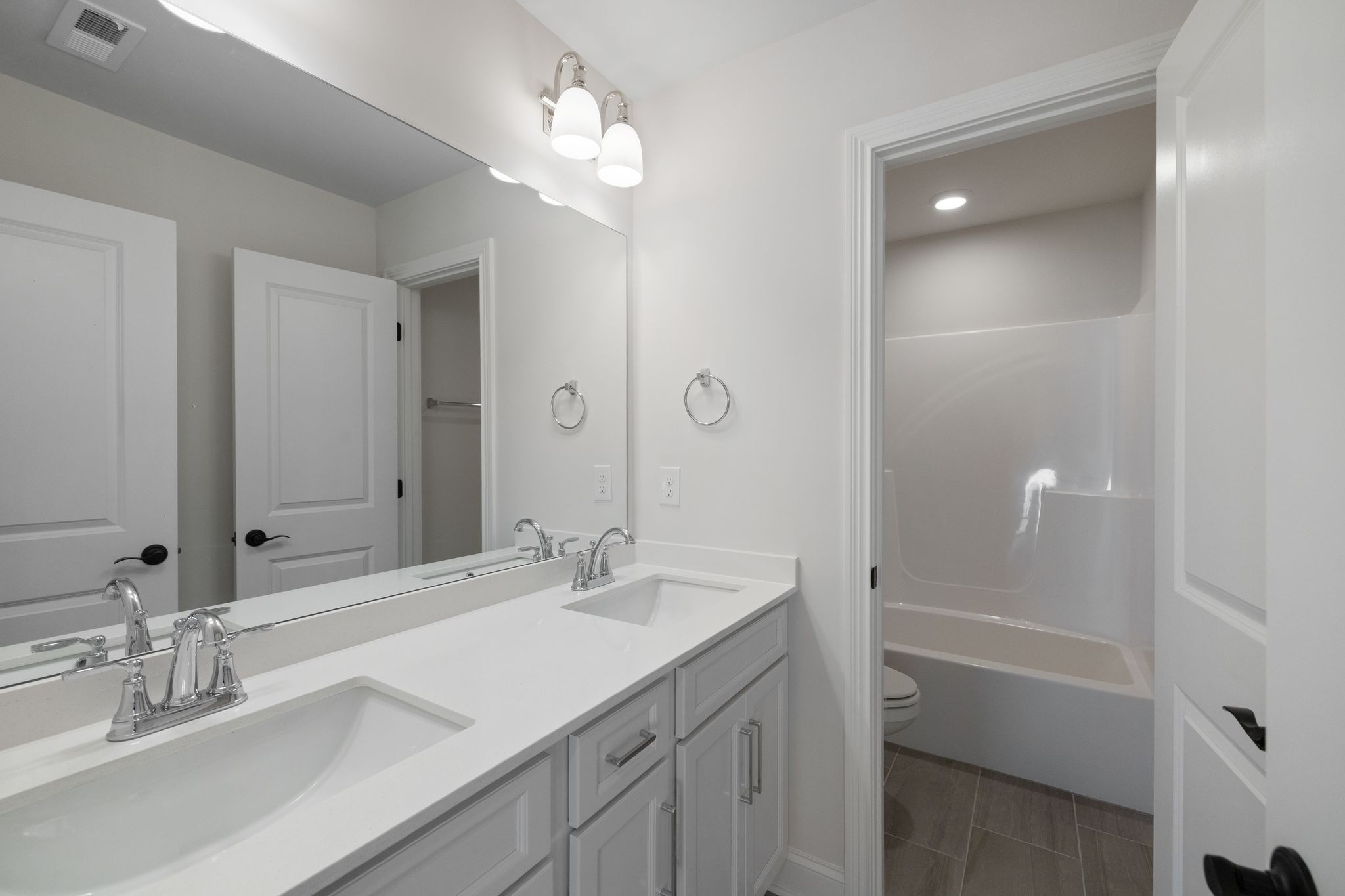 7318 Winners Road Murfreesboro, TN 37129 - Photo 33 of 44 a bathroom with a sink vanity tub and shower