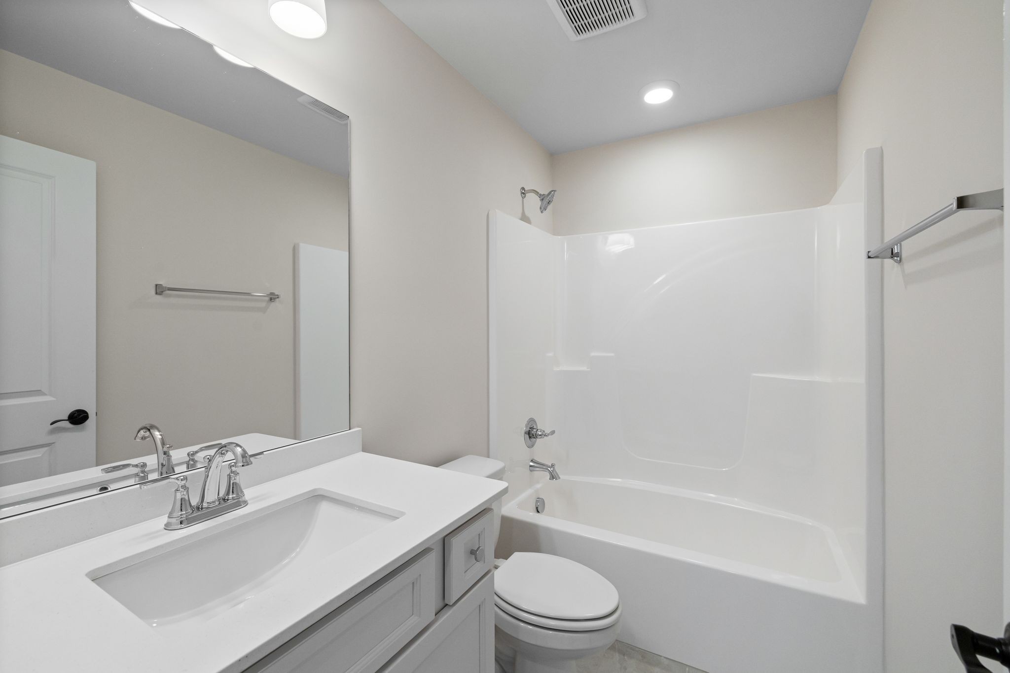 7318 Winners Road Murfreesboro, TN 37129 - Photo 36 of 44 a bathroom with a bathtub shower sink vanity mirror and toilet