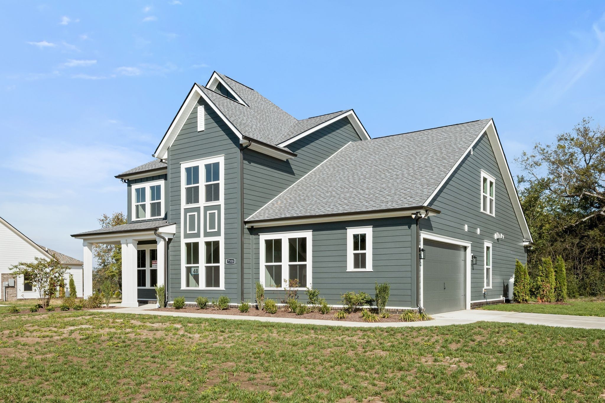 7318 Winners Road Murfreesboro, TN 37129 - Photo 4 of 44 a front view of a house with a yard