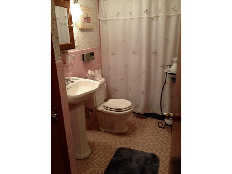 874 Elm Street Woonsocket, RI 02895 - Photo 14 of 24 Bathroom. Ceramic tiled main bath with linen closet.