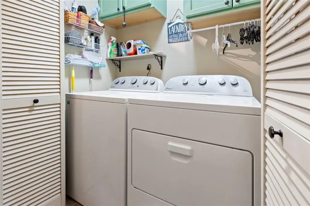 a utility room with dryer and washer