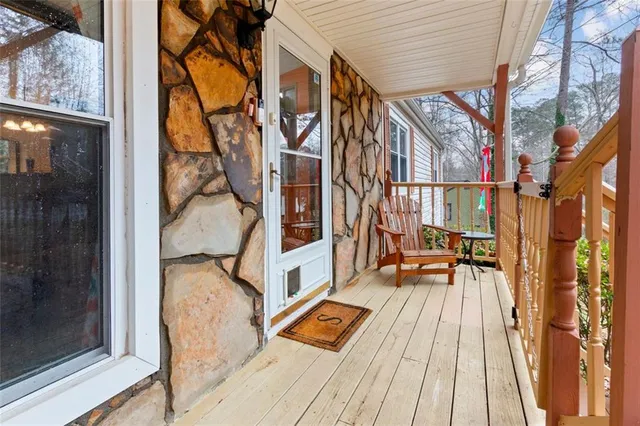 a view of balcony with wooden floor