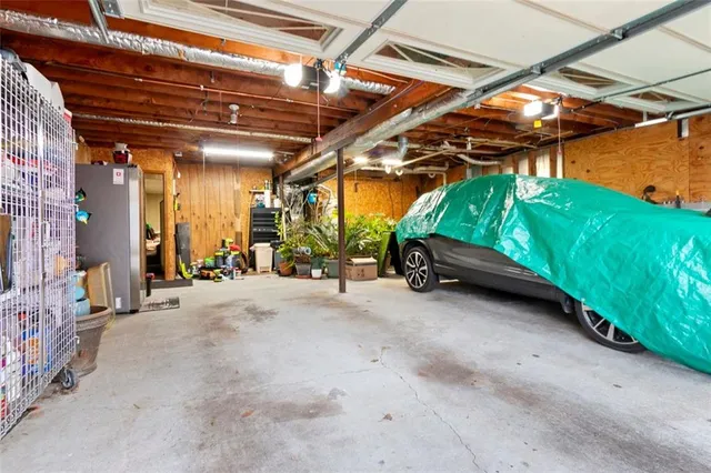a view of a house with wooden fence