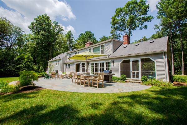 4 Squirrel Hill Road Wayland, MA 01778 - Photo 22 of 23 a patio with sofas fire pit table and chairs