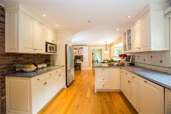 4 Squirrel Hill Road Wayland, MA 01778 - Photo 6 of 23 a large kitchen with stainless steel appliances granite countertop a lot of counter space and wooden floors