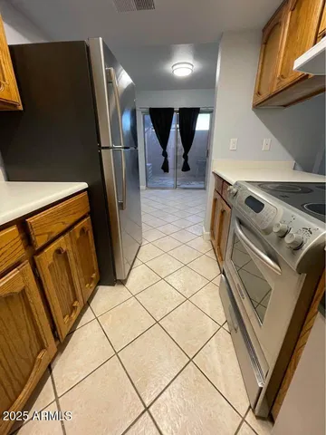 a view of a refrigerator a washer and dryer