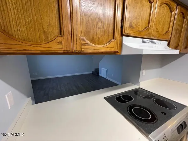 a kitchen with a stove and a microwave