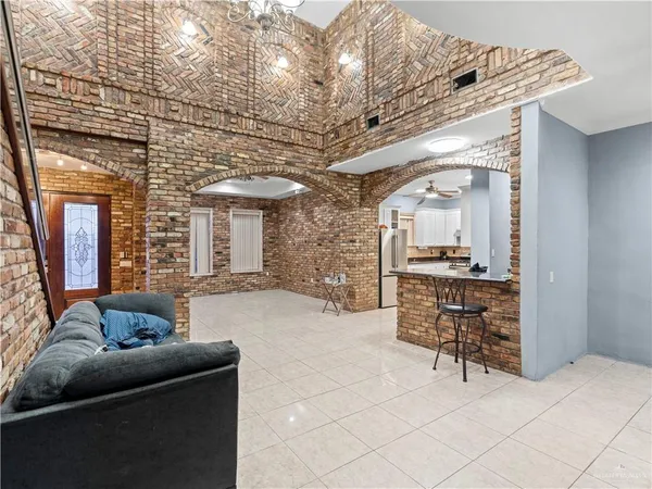 a kitchen with granite countertop a sink stainless steel appliances and cabinets