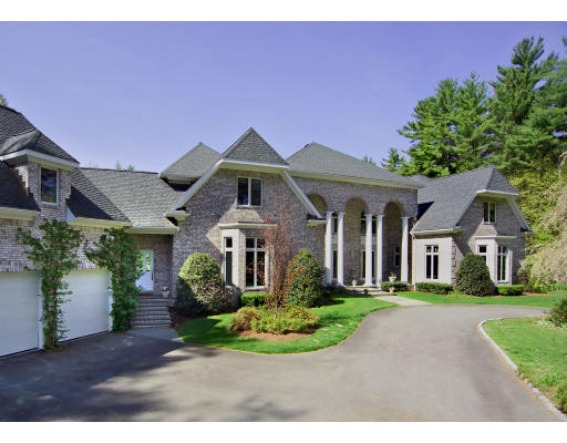 215 Monument Farm Road Concord, MA 01742 - Photo 1 of 8 a front view of a house with a garden