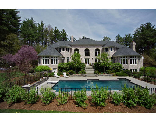 215 Monument Farm Road Concord, MA 01742 - Photo 2 of 8 a front view of a house with a yard and a garden