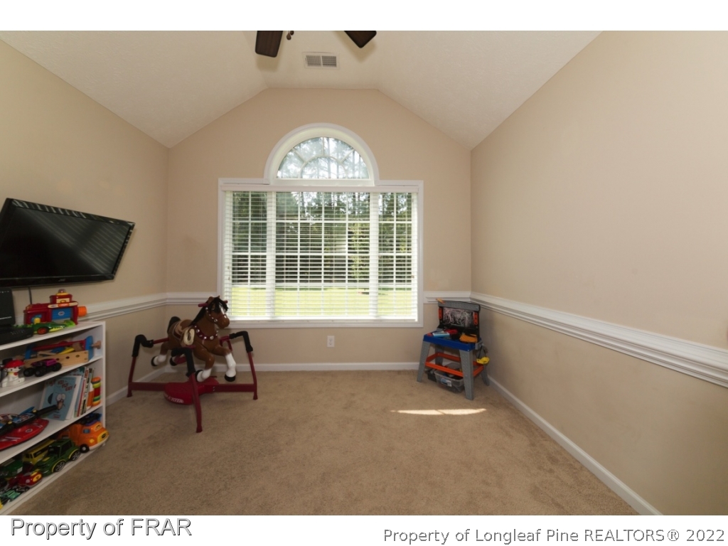 2854 Wade-Stedman Road Stedman, NC 28391 - Photo 20 of 35 a living room with furniture and a flat screen tv