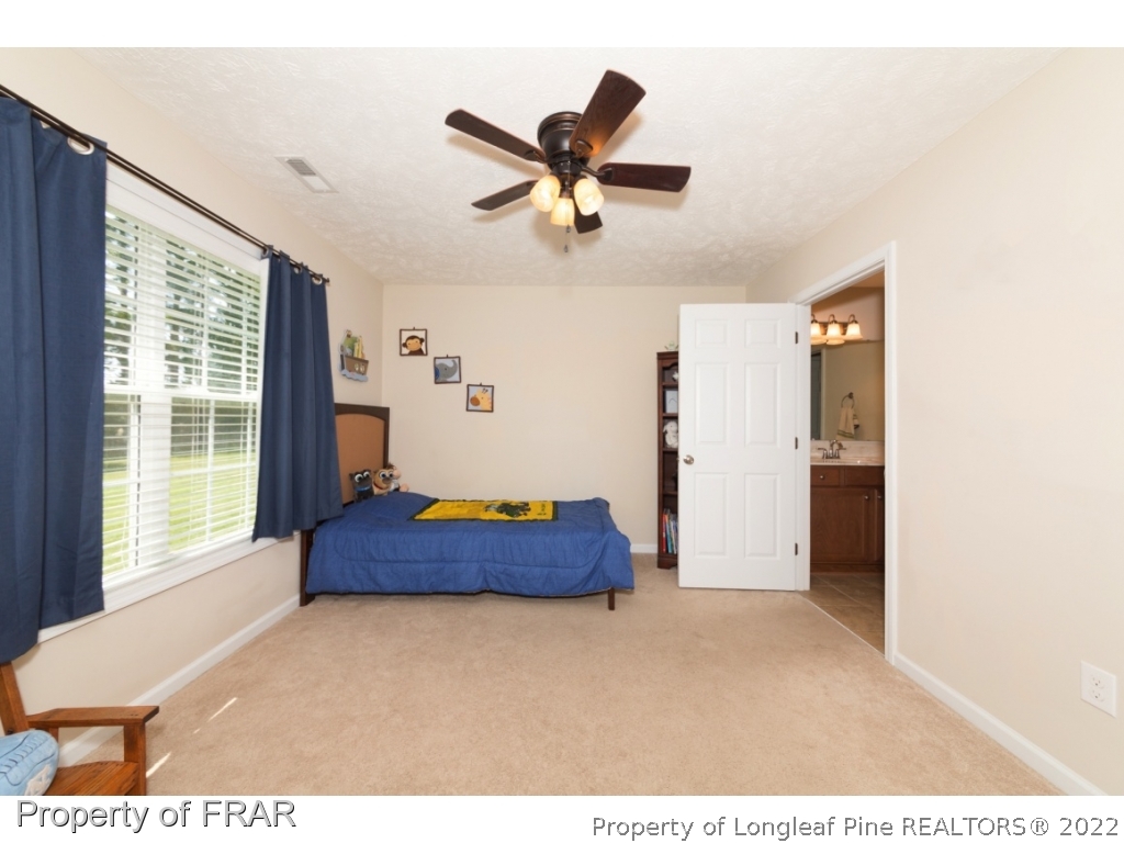 2854 Wade-Stedman Road Stedman, NC 28391 - Photo 24 of 35 a living room with furniture and a ceiling fan