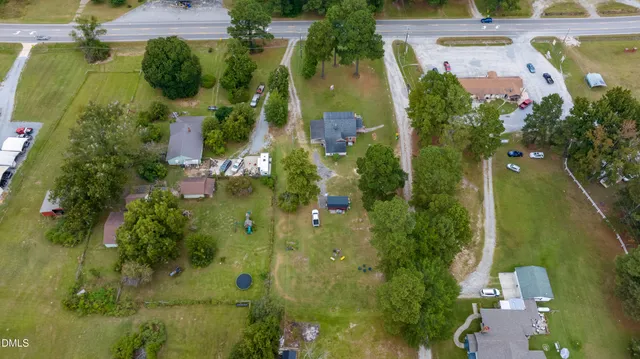 an aerial view of a house with outdoor space