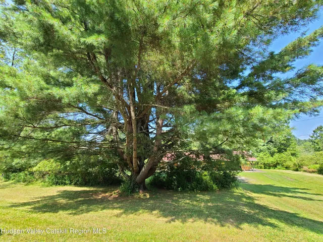 an aerial view of a house with mountain view