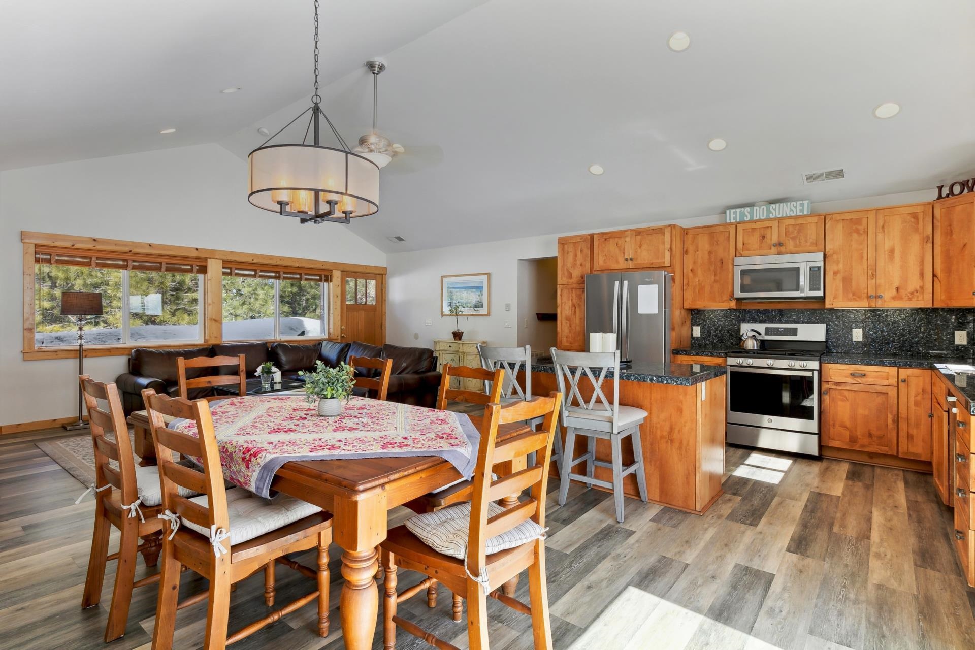 10383 Sugar Pine Road Truckee, CA 96161 - Photo 13 of 21 a view of a dining room with furniture large window and wooden floor