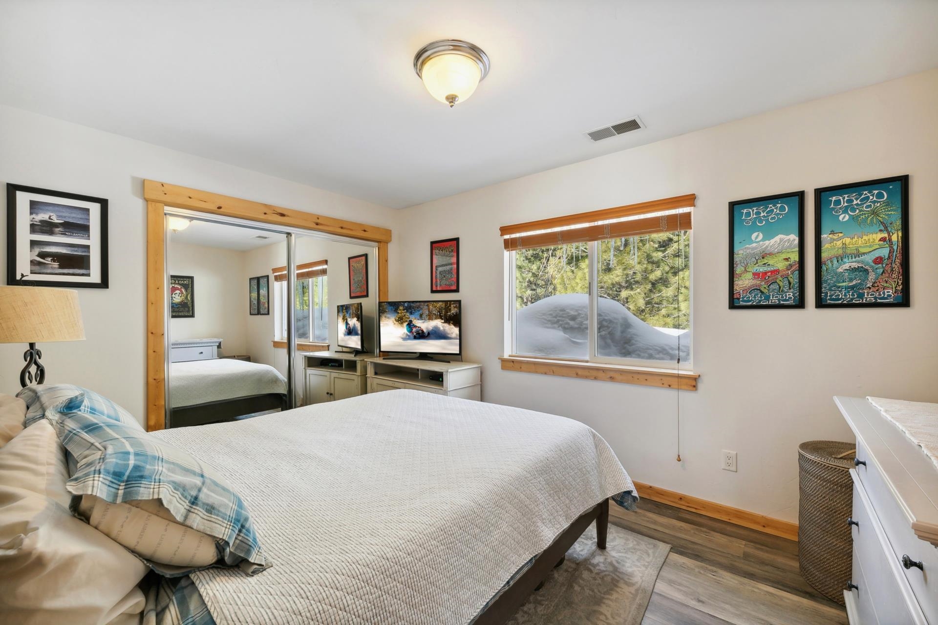 10383 Sugar Pine Road Truckee, CA 96161 - Photo 17 of 21 a bedroom with a bed and wooden floor