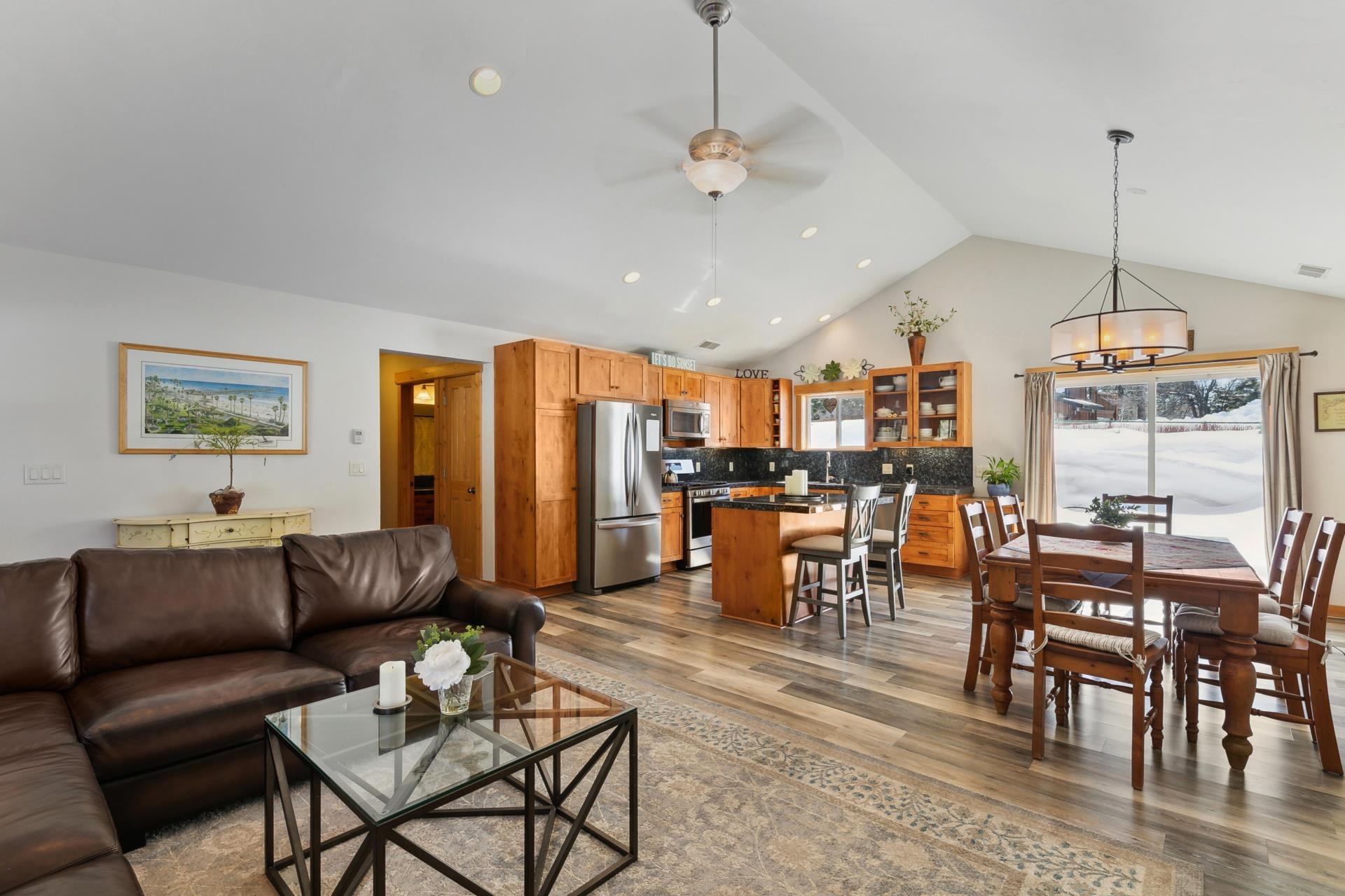 10383 Sugar Pine Road Truckee, CA 96161 - Photo 2 of 21 a living room with lots of furniture and a view of kitchen chandelier