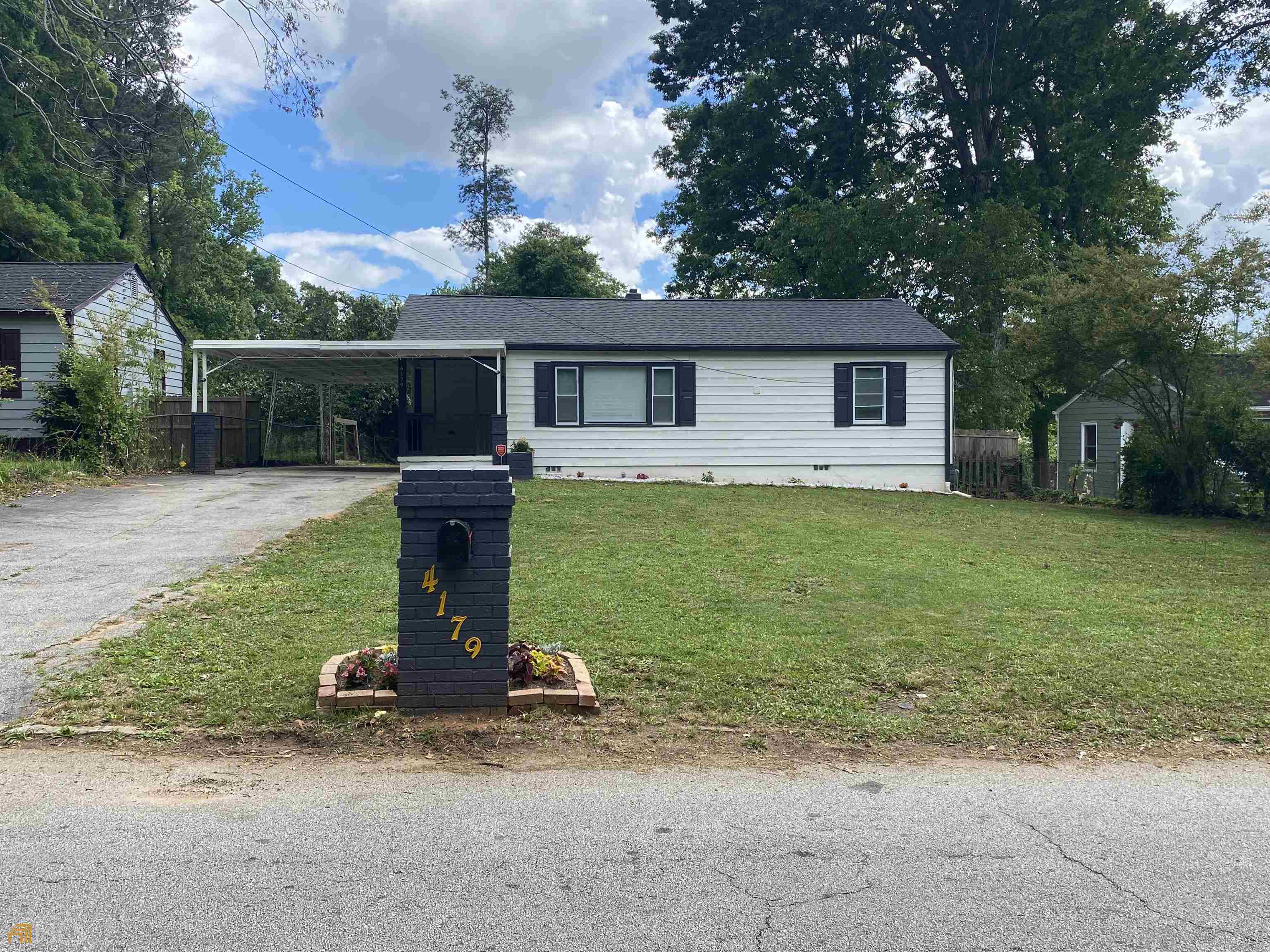 4179 Lindsey Drive Decatur, GA 30035 - Photo 1 of 1 a view of a house with backyard and a tree