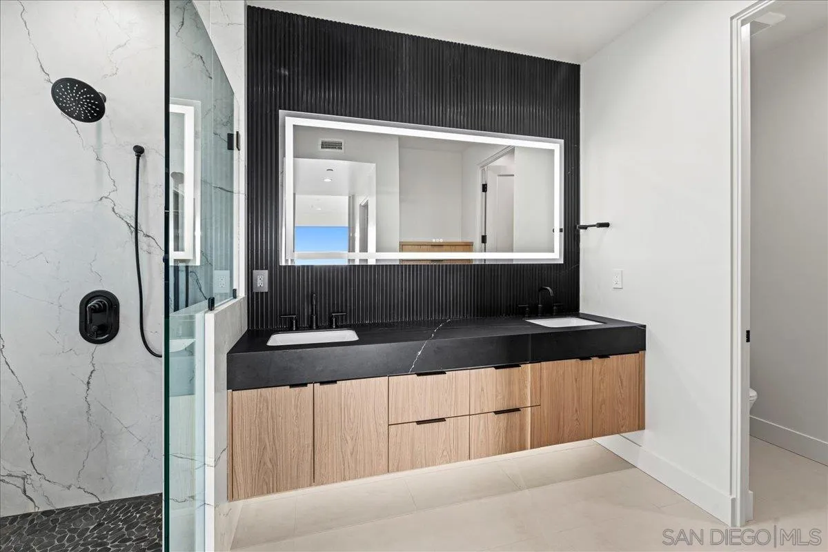 1009 Arcadia Road Encinitas, CA 92024 - Photo 23 of 37 a view of a bathroom with a tub and shower