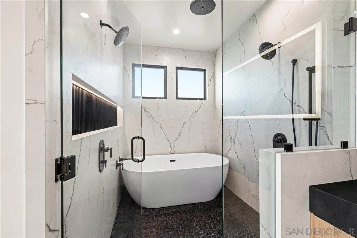 1009 Arcadia Road Encinitas, CA 92024 - Photo 25 of 37 a bathroom with a sink and mirror