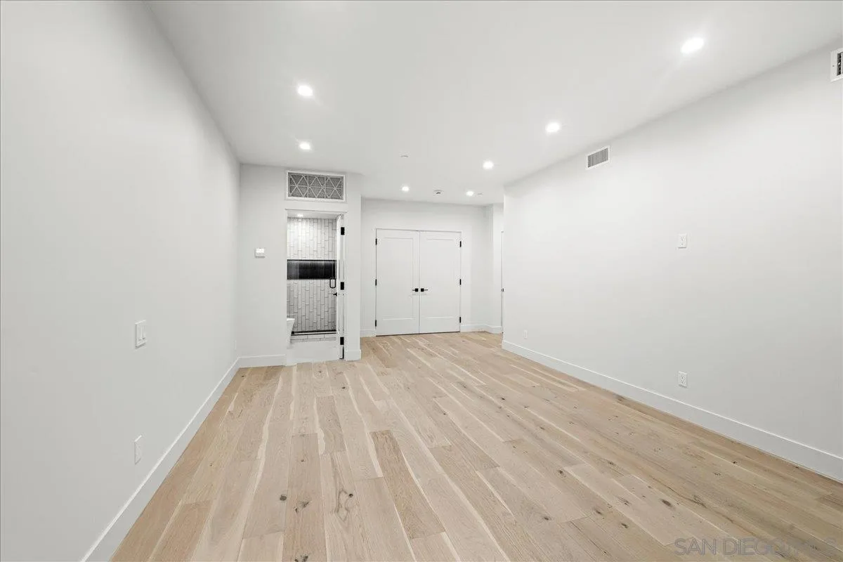 1009 Arcadia Road Encinitas, CA 92024 - Photo 29 of 37 a view of empty room with wooden floor
