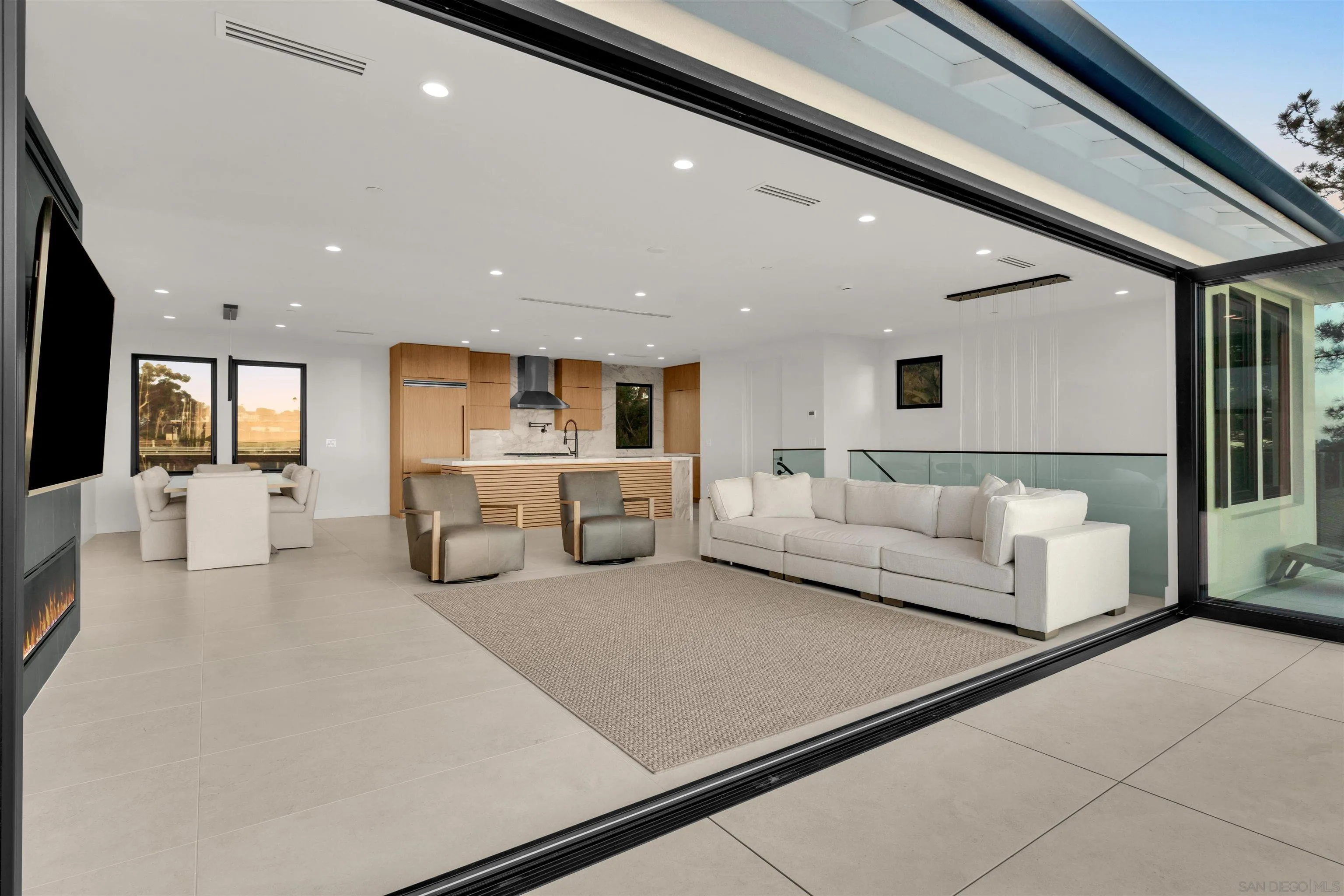 1009 Arcadia Road Encinitas, CA 92024 - Photo 7 of 37 a living room with furniture and kitchen view