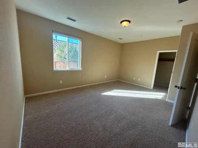 a view of empty room with windows