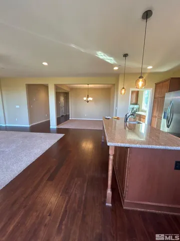 a kitchen with a table and chairs in it
