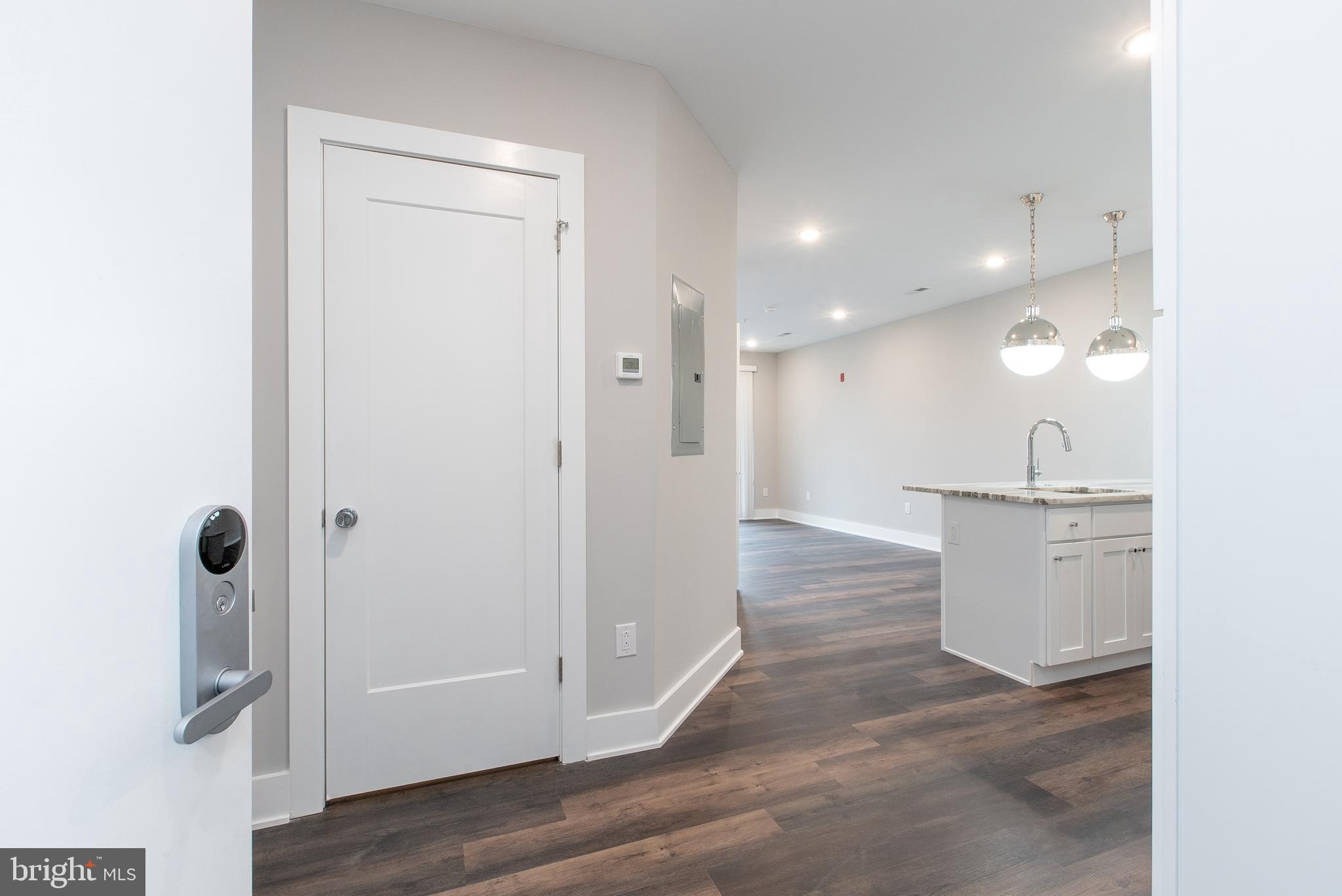 45 West Haines Street, Unit 303 Philadelphia, PA 19144 - Photo 11 of 24 a view of a hallway with wooden floor